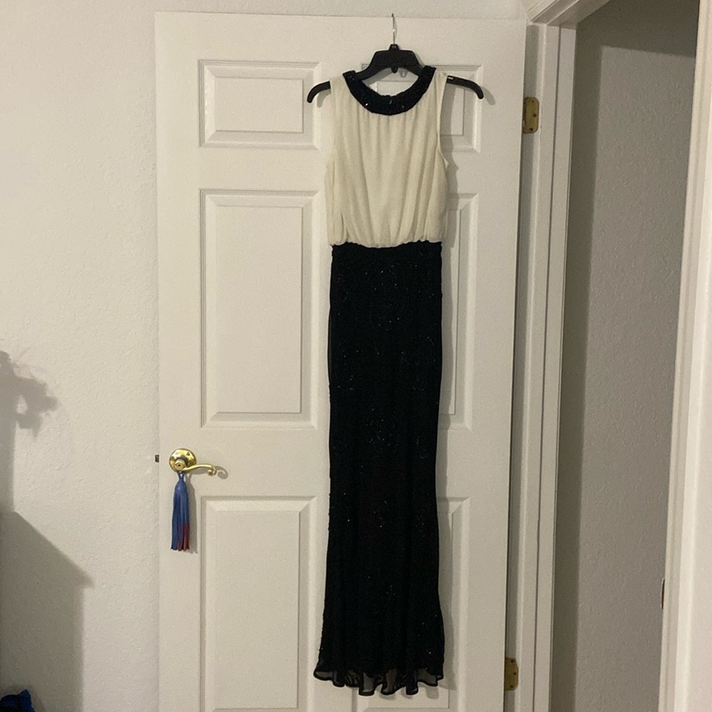 Stunning Aidan  Mattox gown with rose like sequins. Cream and black chiffon